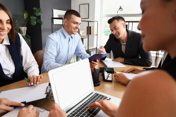 Business people negotiating at table in conference hall