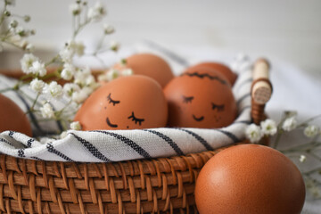 Easter eggs on a rustic table in a basket.