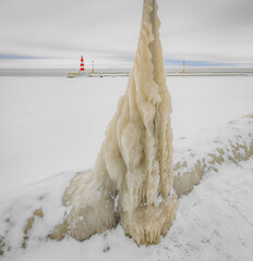 Spectacular ice formations on a cold and windy day. Natural phenomenon. Many objects in Nida town,...