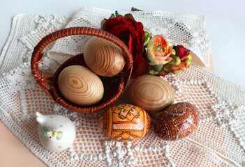 Fototapeta na wymiar Background with hand crafted wooden easter eggs (pysanka) from Ukraine