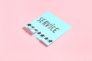 Paper with word SERVICE and stars on pink background. Customer experience concept