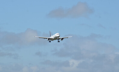 Passenger jet plane approaching the runway for landing