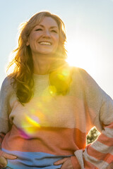 Attractive Smiling Middle Aged Woman Outside in Sunshine