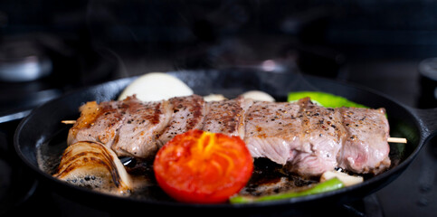 lamb meat cooked in a cast iron pan