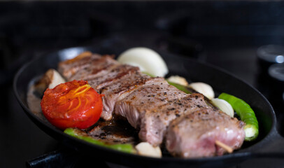 lamb meat cooked in a cast iron pan