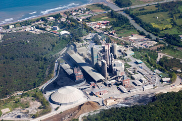 Aerial view of cement factory with high concrete plant structure 