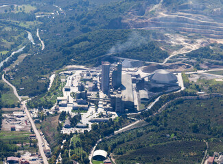 Aerial view of cement factory with high concrete plant structure 