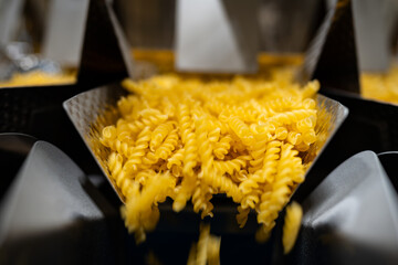 fusilli - a type of pasta - pasta factory and packaging