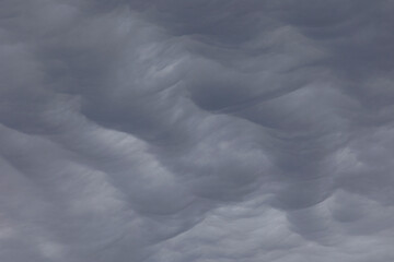 Cloud cover of wavy dark Asperitas clouds in the sky