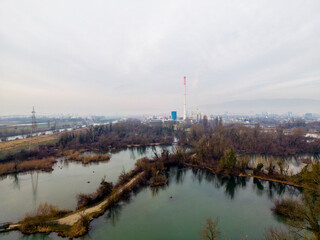 Fototapeta premium Hidden lakes on the eastern part of Zagreb city, Croatia, created by the Sava river tributaries, now used for fishing and walking in nature photographed with drone