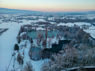 Aerial view of Bobovica lakes near Samobor, Croatia, covered in white snow and thick ice during winter season