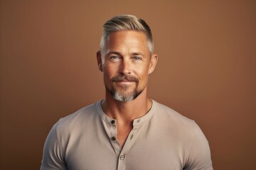 Fototapeta premium Portrait of a handsome middle aged man. Men's beauty, fashion. Studio shot