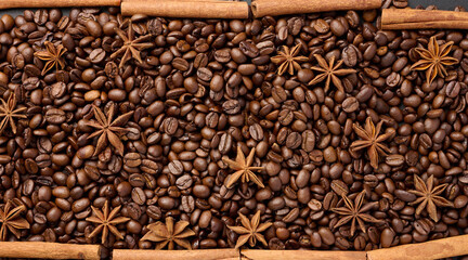 Roasted coffee beans, cinnamon sticks and star anise, full frame
