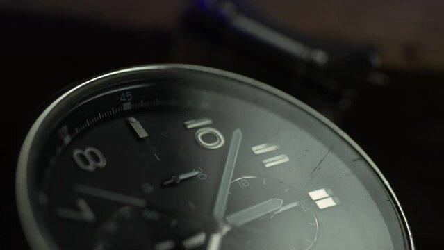 Lost Watch with a Broken Bracelet illuminated by Emergency Lights. Close-up, shallow dof.