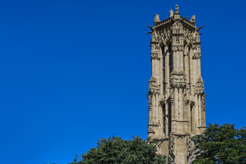 Paris, France, June 2022. Beautiful shot of the Tour Saint-Jacques, the only evidence of a church demolished during the French Revolution. The numerous statues that decorate it are striking.