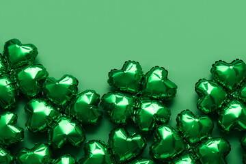 Balloons in shape of clover on green background. St. Patrick's Day celebration