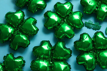 Balloons in shape of clover on blue background. St. Patrick's Day celebration