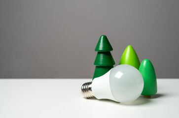 Economical LED light bulb and tree figurines. Energy savings, longevity, and environmental...