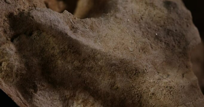 Rock Stone texture close-up. Rought mountain surface. Geological sample. Wall in cave. Macro shot natural mineral background. 