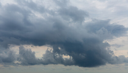 Naklejka na ściany i meble View of grey cloudy summer sky before rain. Nature background..