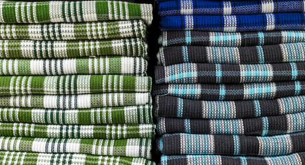 Closeup shot of a large pile of towels stacked up on top of each other