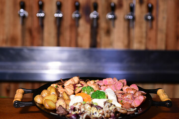 roast beef with cheese bacon pork sausage roast potato and salad file mignon with salad