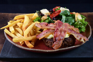 beef burger with bacon fries and salad fast food