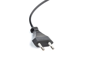 Black power cable isolated on a white background, close -up. (selective focus)