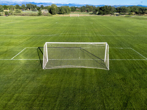 Aerial view of soccer field with goal in foreground