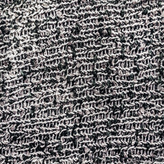 Seamless texture photo of light gray wool calico sweater material.