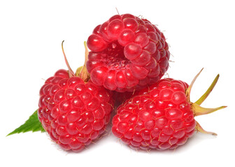 Raspberry with leaves isolated on white background