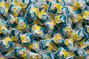 Dishwasher detergent capsules and or laundry soap full frame background.