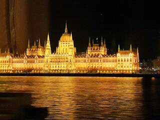 Fototapeta na wymiar Hungary Budapest night sailing and view of Buildings infrastructures bridges landmarks in the city along Rhine river and Danube river 