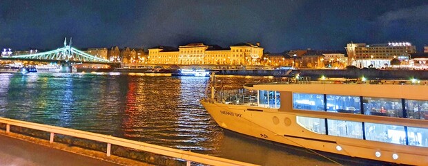 Hungary Budapest night sailing and view of Buildings infrastructures bridges landmarks in the city...