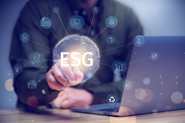 ESG sustainable investment concept, investor touching environmental social governance( ESG) icon on virtual hologram, sustainability, investing.sustainability, investing.