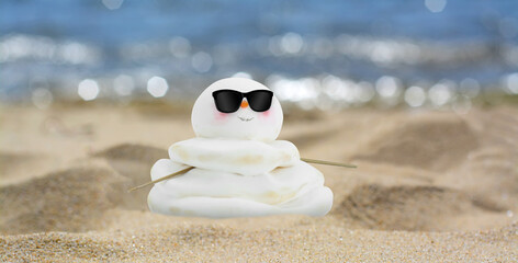 Fototapeta na wymiar Cute small decorative snowman with sunglasses on sandy beach near sea, banner design