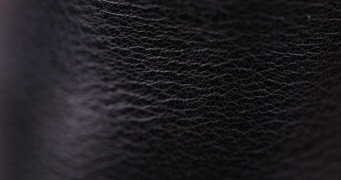 parts and details of clothing made of black leather, close-up of black leather