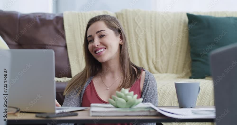 Poster Happy, laptop and woman on video call in living room waving hello for greeting communication. Smile, technology and young female person from Canada on virtual conversation with computer at home.