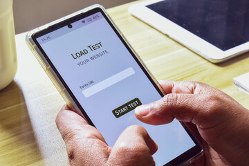 Person using smartphone mobile applications for API testing. Stress test or load test your website...