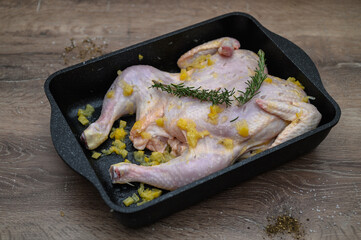 chicken tabaka marinated before cooking in the kitchen 12