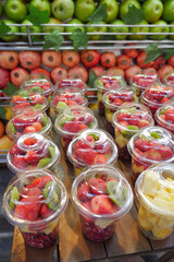 pineapple, kiwi and Strawberries in. plastic container selling at shop 