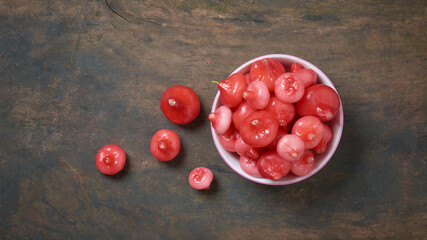 jambu or rose apple, aka bell fruit or wax apple, flesh is crisp and watery, cup full of bell-like...