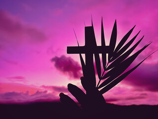 Silhouette of hand holding palm leaves and cross with purple sky background. Lent, Holy Week, Palm...
