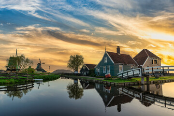 Sunrise at Zaanse Schans village with Dutch Windmill near Amsterdam Netherlands - obrazy, fototapety, plakaty