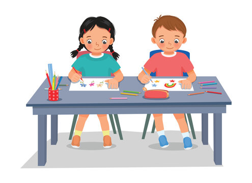 Cute kids students drawing picture at the table together