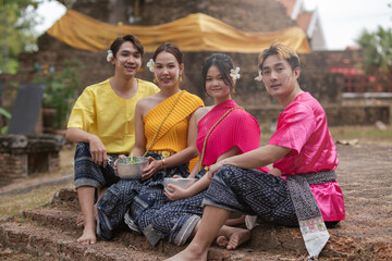 Songkran Day, young Thai people wear Thai clothes and celebrate on Songkran Day.