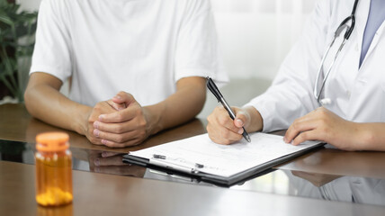 Female doctors who treat patients make an appointment to listen to the results after a physical...