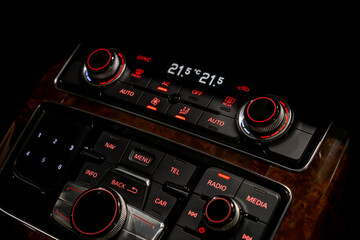 Interior of modern luxury car. Details of automatic transmission gear shift, multimedia control...