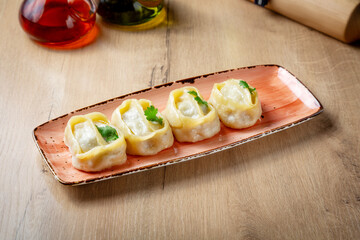 Traditional Uzbek manti on a plate, lunch, cafe restaurant