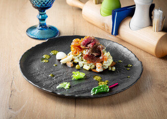 Salad with roast beef, vegetables and egg on a plate, lunch, cafe restaurant